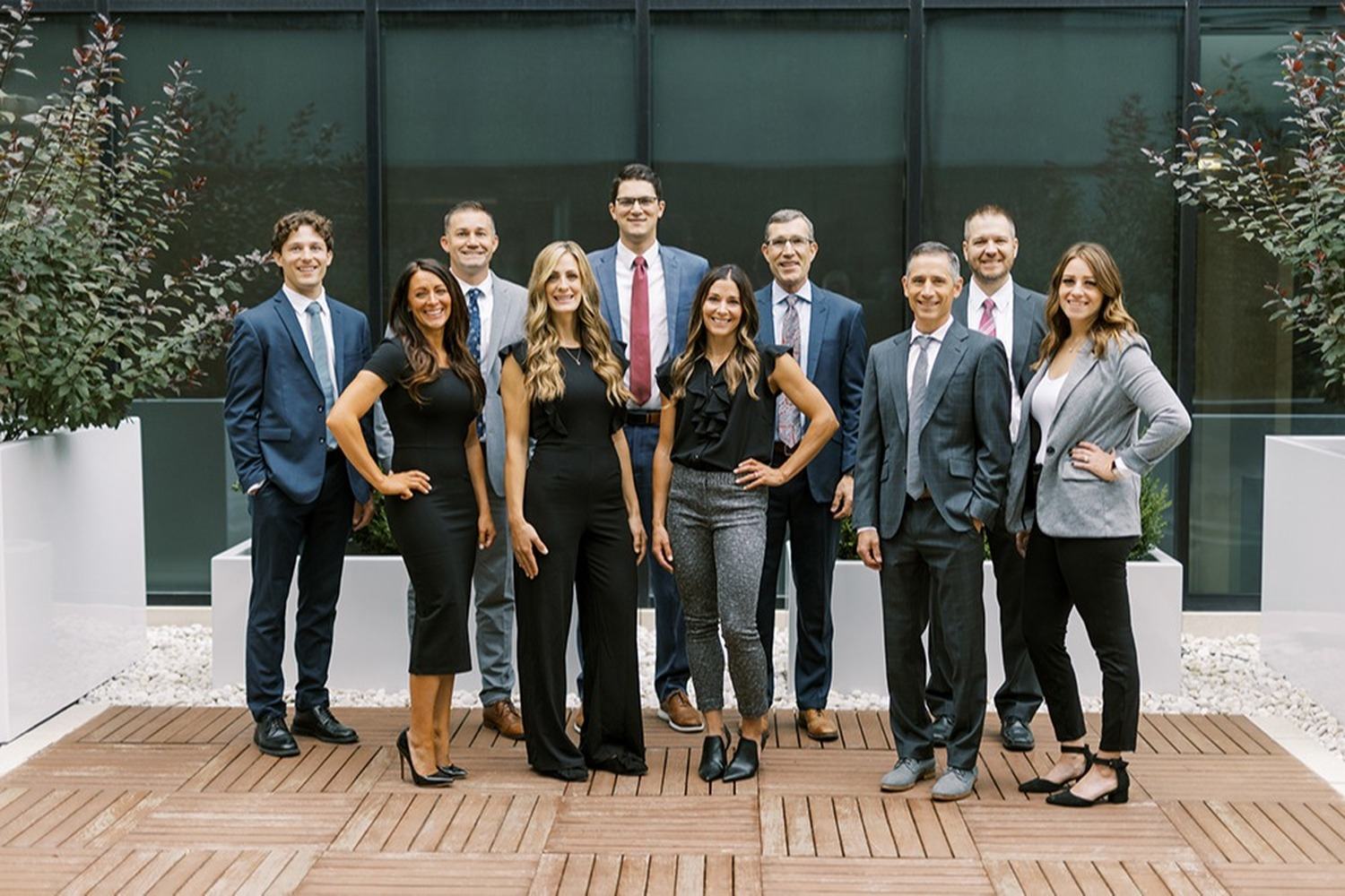 The Cornerstone Advisors team standing together outside their offices